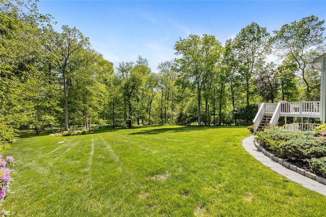 47 Londonderry Ln, Somers, NY 10589 - view of green lawn with stairs and a deck