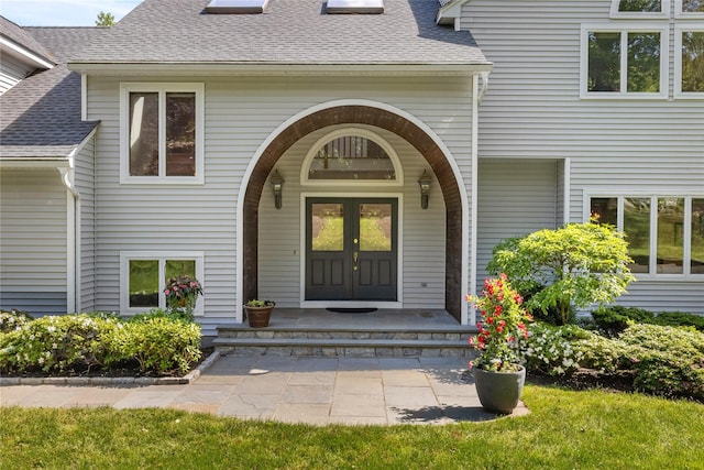 47 Londonderry Ln, Somers, NY 10589 - view of exterior entry with a shingled roof and french doors