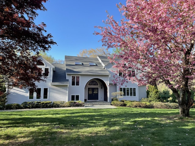 47 Londonderry Ln, Somers, NY 10589 - view of front of house featuring a front yard and roof with shingles