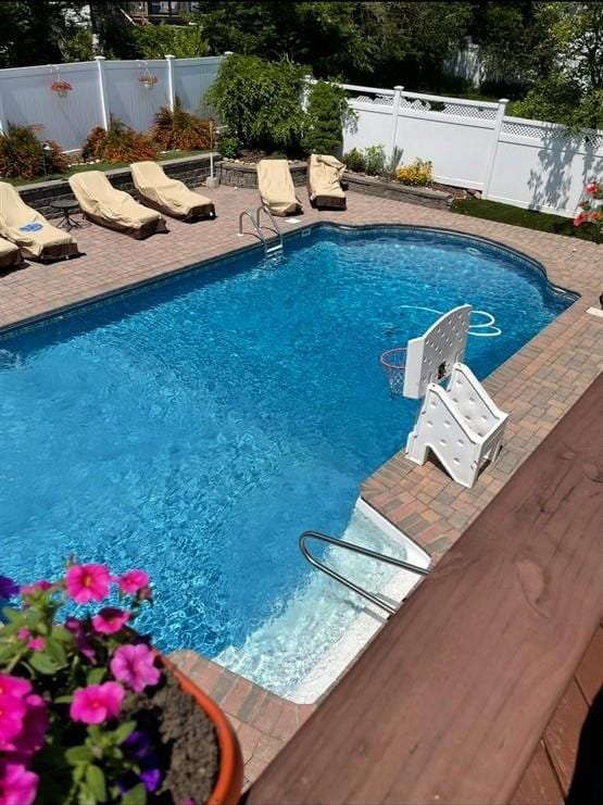 11 Fishermans Dr, Port Washington, NY 11050 - view of swimming pool featuring a fenced backyard and a patio