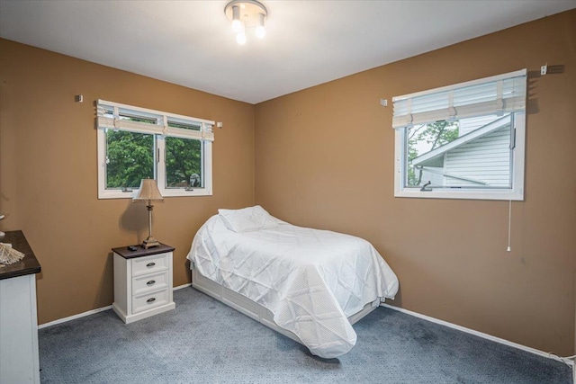 11 Fishermans Dr, Port Washington, NY 11050 - carpeted bedroom featuring multiple windows