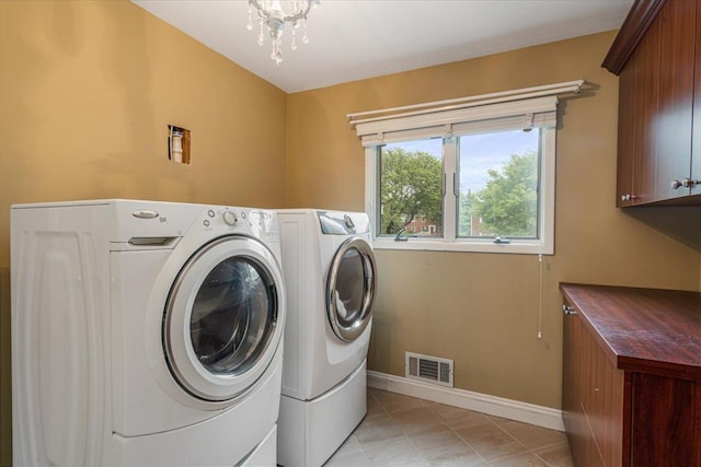 11 Fishermans Dr, Port Washington, NY 11050 - laundry area with cabinet space, separate washer and dryer, and light tile patterned floors