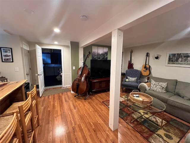 living room featuring light wood-style flooring and recessed lighting
