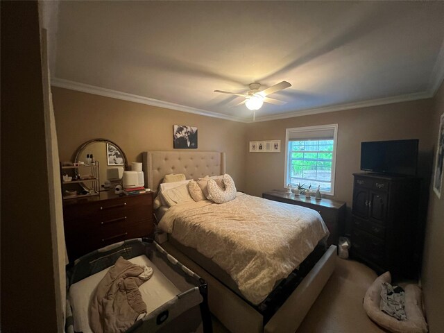 bedroom with ornamental molding and ceiling fan