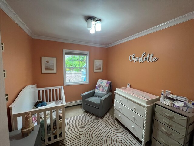 bedroom with ornamental molding, a baseboard radiator, carpet floors, and baseboards