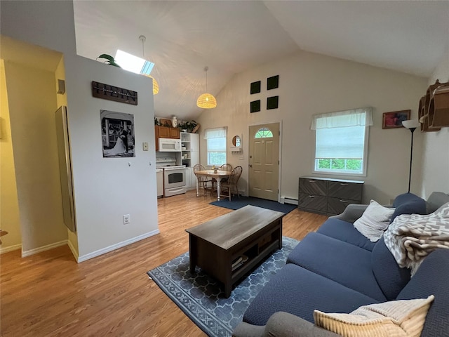 living room featuring a baseboard heating unit, light wood-style floors, high vaulted ceiling, and baseboards