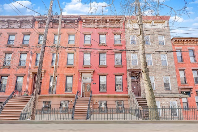 146 Nelson St, Brooklyn, NY 11231 - view of apartment building / complex with a fenced front yard and entry steps