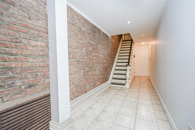 146 Nelson St, Brooklyn, NY 11231 - hallway featuring brick wall, baseboards, stairs, recessed lighting, and ornamental molding