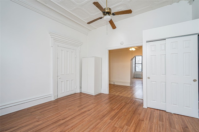 146 Nelson St, Brooklyn, NY 11231 - unfurnished bedroom featuring light wood-style floors, a closet, an ornate ceiling, and a ceiling fan