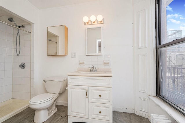 146 Nelson St, Brooklyn, NY 11231 - bathroom with tiled shower, toilet, vanity, and decorative backsplash