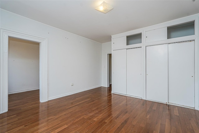 146 Nelson St, Brooklyn, NY 11231 - unfurnished bedroom featuring multiple closets, wood finished floors, ornamental molding, and baseboards