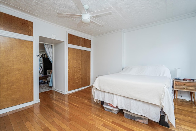 146 Nelson St, Brooklyn, NY 11231 - bedroom featuring crown molding, an ornate ceiling, hardwood / wood-style floors, ceiling fan, and a closet