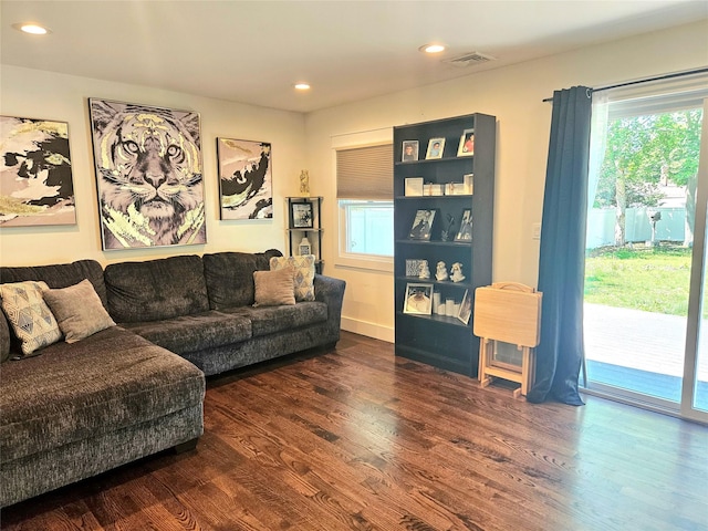 15 Ormond Ave, Selden, NY 11784 - living room with healthy amount of natural light, wood finished floors, and recessed lighting