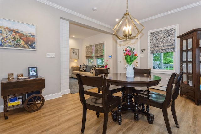dining room featuring light wood finished floors, a chandelier, ornamental molding, baseboards, and recessed lighting