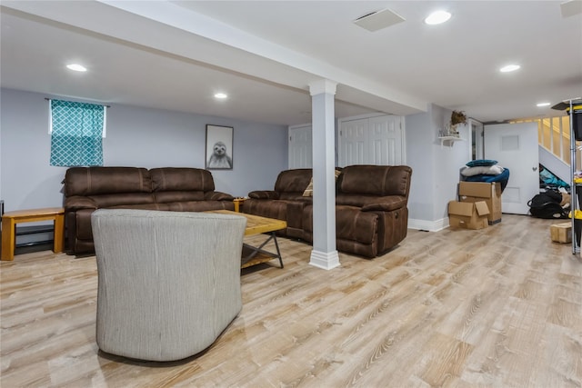living area featuring light wood-type flooring, recessed lighting, baseboards, and a baseboard radiator
