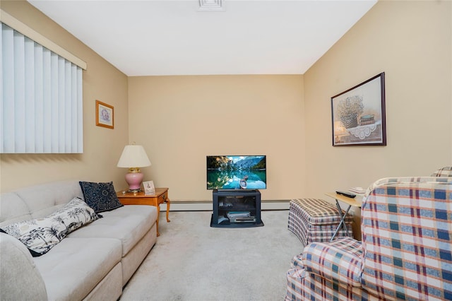 carpeted living area with a baseboard heating unit and baseboards