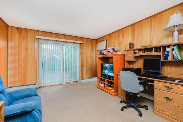 carpeted office space with wood walls and a baseboard radiator