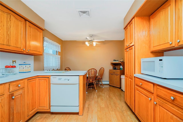 kitchen with white appliances, a baseboard radiator, light wood-type flooring, and light countertops