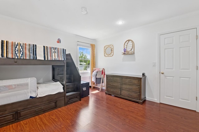 40 Grafton St, Greenlawn, NY 11740 - bedroom with ornamental molding, dark wood-style flooring, and baseboards