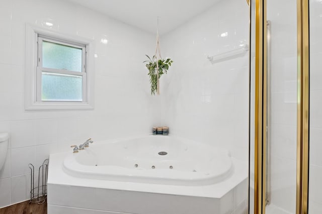 40 Grafton St, Greenlawn, NY 11740 - full bath with a jetted tub, a shower stall, toilet, and tile walls