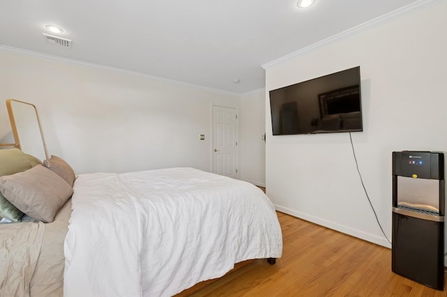 40 Grafton St, Greenlawn, NY 11740 - bedroom featuring crown molding, light wood-style flooring, baseboards, and recessed lighting