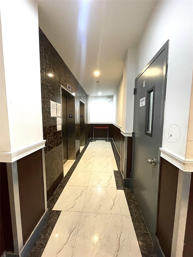 70-26 Queens Blvd Unit 10B, Woodside, NY 11377 - corridor with elevator, marble tiled flooring, and baseboards