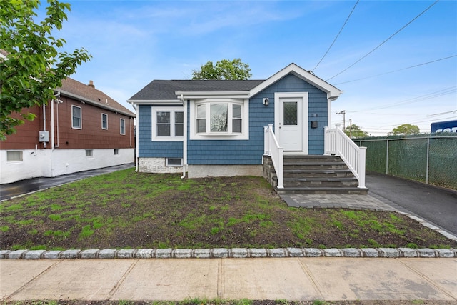 208 W Alhambra Ave, Lindenhurst, NY 11757 - view of front facade featuring fence