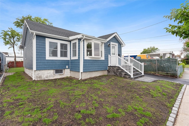 208 W Alhambra Ave, Lindenhurst, NY 11757 - view of front of house featuring a shingled roof