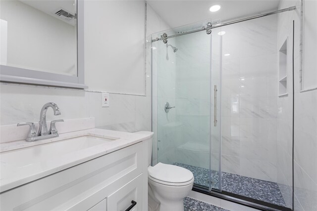 208 W Alhambra Ave, Lindenhurst, NY 11757 - bathroom with a shower stall, toilet, vanity, and recessed lighting