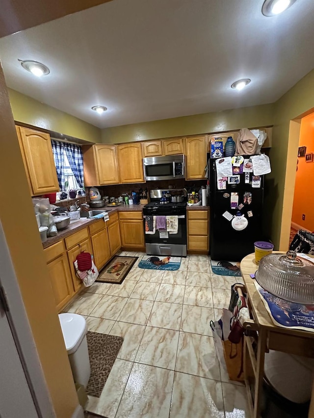 14207 135th Ave, Jamaica, NY 11436 - kitchen featuring appliances with stainless steel finishes, dark countertops, and recessed lighting