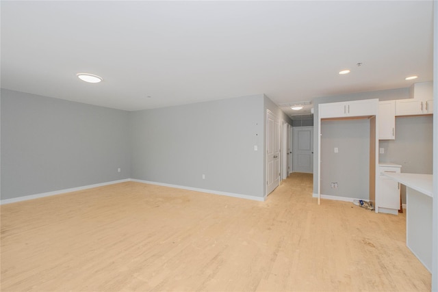 31 Cunard Ave, Staten Island, NY 10304 - unfurnished living room with light wood-type flooring, recessed lighting, baseboards, and attic access