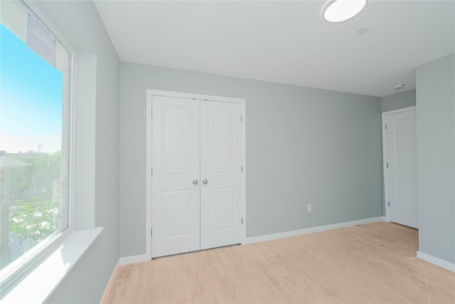 31 Cunard Ave, Staten Island, NY 10304 - unfurnished bedroom with light wood-type flooring, baseboards, and a closet