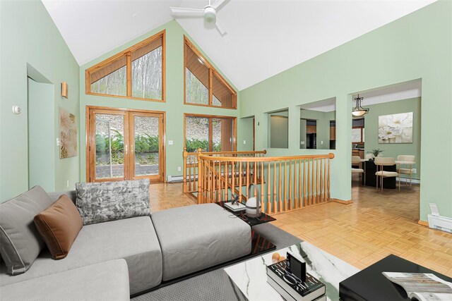 24 Babbling Brook Ln, Cold Spring, NY 10516 - living room with high vaulted ceiling, a baseboard radiator, baseboards, and ceiling fan