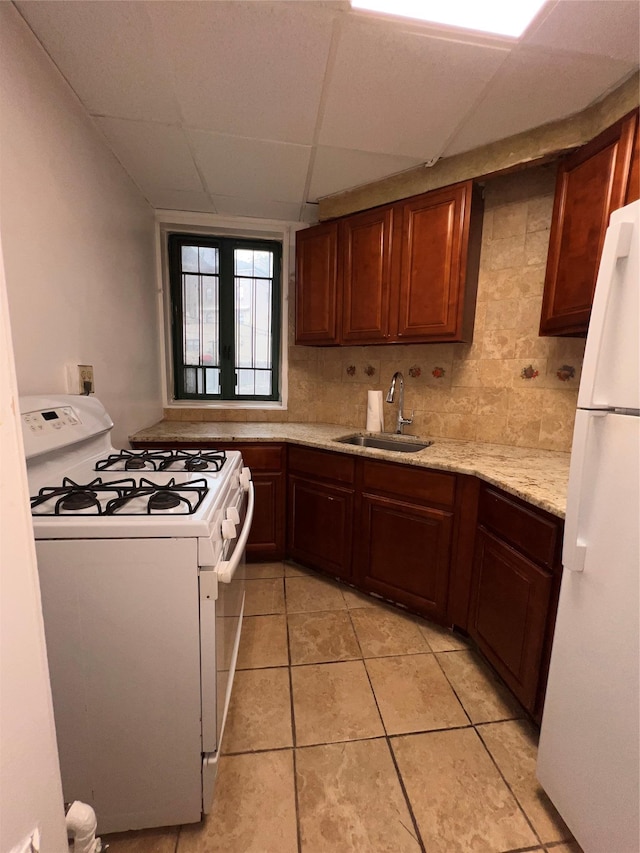 1722 Purdy St Unit Mc, Bronx, NY 10462 - kitchen featuring white appliances, a sink, a drop ceiling, backsplash, and light tile patterned flooring