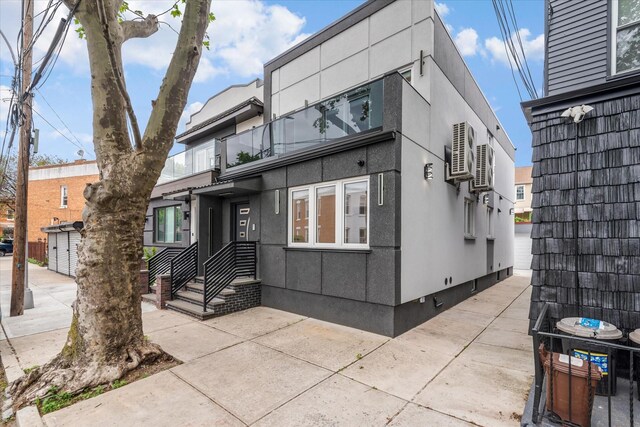 61-13 62nd St, Middle Village, NY 11379 - view of front of property with stucco siding