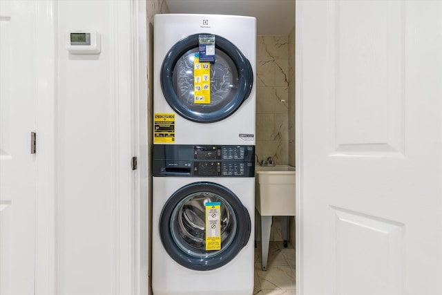 61-13 62nd St, Middle Village, NY 11379 - laundry area with stacked washer / drying machine