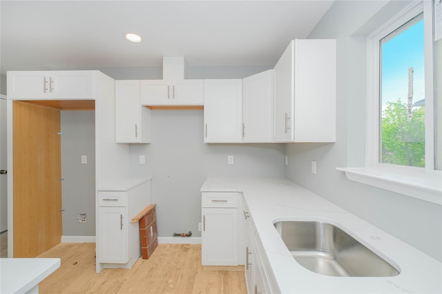 43 Cunard Ave, Staten Island, NY 10304 - kitchen featuring a sink, light wood-style floors, white cabinetry, healthy amount of natural light, and recessed lighting