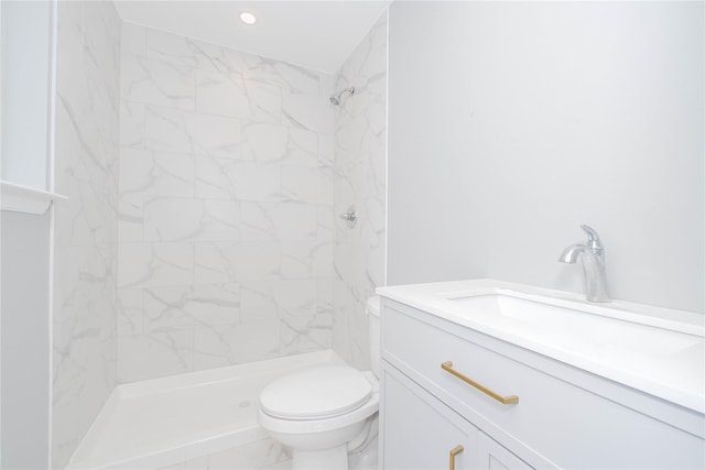 43 Cunard Ave, Staten Island, NY 10304 - bathroom with a tile shower, toilet, marble look tile flooring, vanity, and recessed lighting