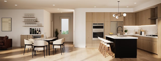 32.1 Orchard Dr, Armonk, NY 10504 - kitchen with modern cabinets, light countertops, appliances with stainless steel finishes, recessed lighting, and an island with sink