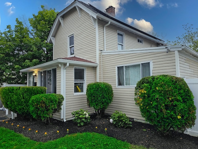 25 Center Ave, Bay Shore, NY 11706 - view of home's exterior with a chimney