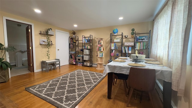 25 Center Ave, Bay Shore, NY 11706 - dining space featuring wood finished floors, recessed lighting, and a baseboard radiator