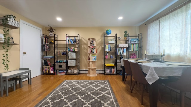 25 Center Ave, Bay Shore, NY 11706 - home office featuring wood finished floors, recessed lighting, and baseboard heating