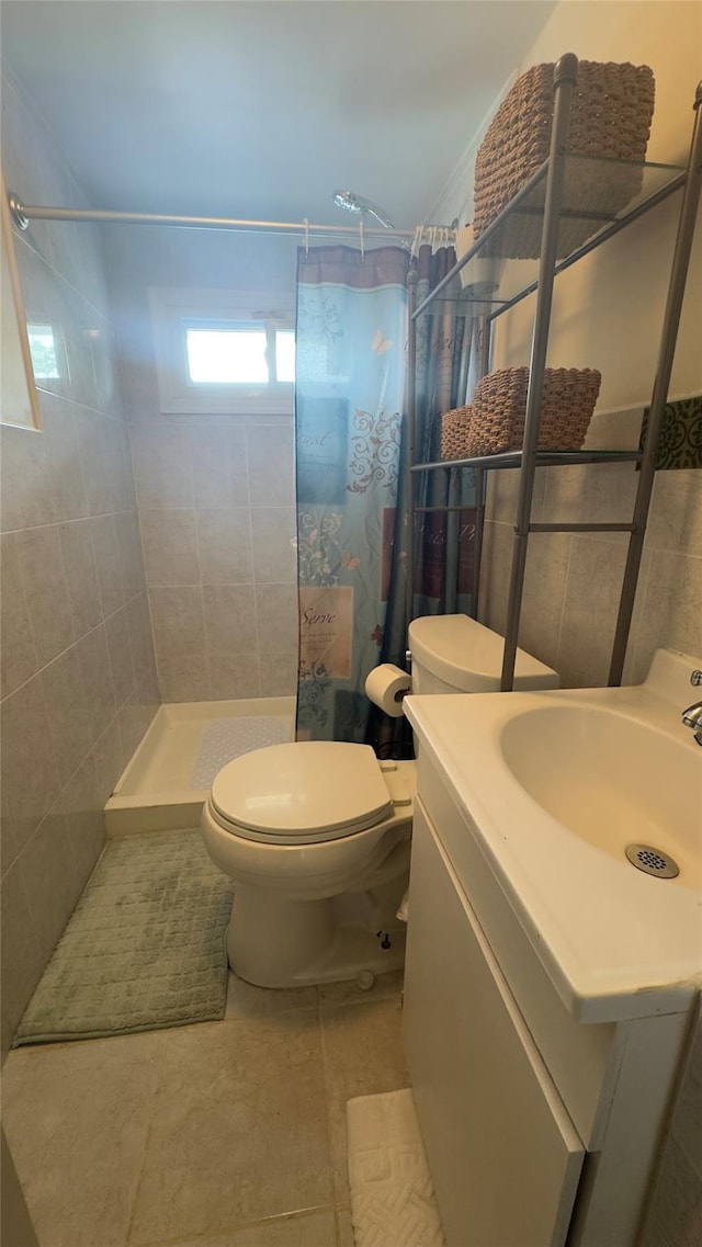 25 Center Ave, Bay Shore, NY 11706 - full bathroom featuring a tile shower, toilet, vanity, and tile patterned flooring