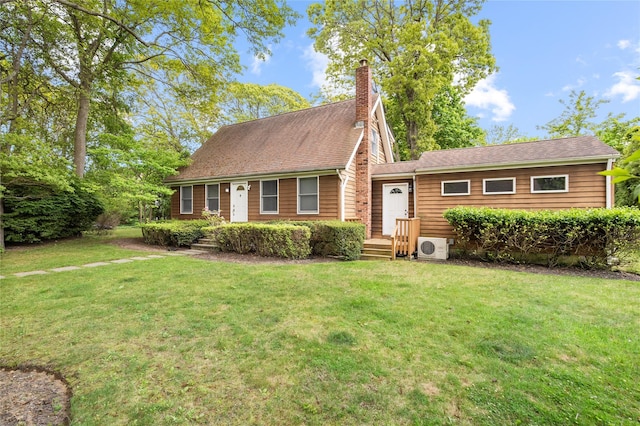 60 Hagerman Ave, East Patchogue, NY 11772 - view of front of home featuring a chimney, a front lawn, and ac unit