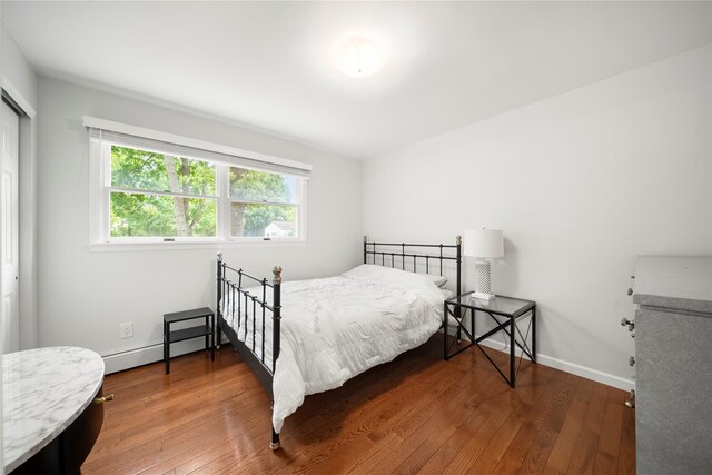 60 Hagerman Ave, East Patchogue, NY 11772 - bedroom featuring hardwood / wood-style floors, a closet, and baseboards