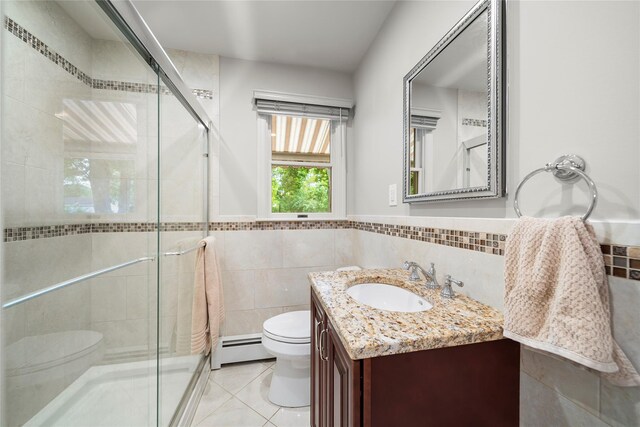 60 Hagerman Ave, East Patchogue, NY 11772 - full bath featuring toilet, a baseboard radiator, vanity, a stall shower, and tile walls