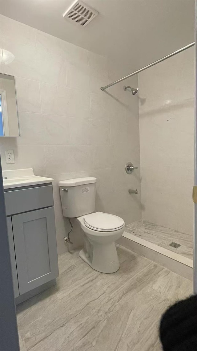 1505 E 29th St, Brooklyn, NY 11229 - bathroom featuring a stall shower, toilet, and vanity
