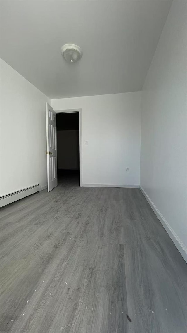 1505 E 29th St, Brooklyn, NY 11229 - spare room featuring baseboards and wood finished floors