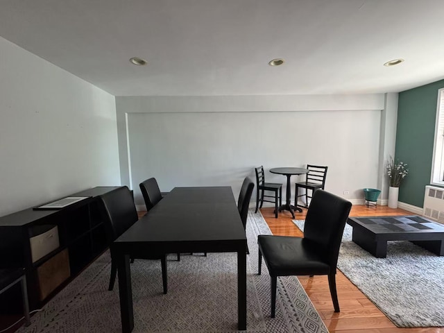 dining area featuring wood finished floors, recessed lighting, and baseboards