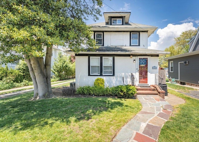 1064 Highland Pl, Woodmere, NY 11598 - traditional style home featuring a front lawn and stucco siding